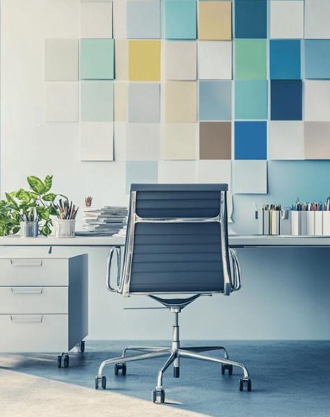 Rear view of painter man painting the wall, with paint roller and bucket, isolated on big empty space