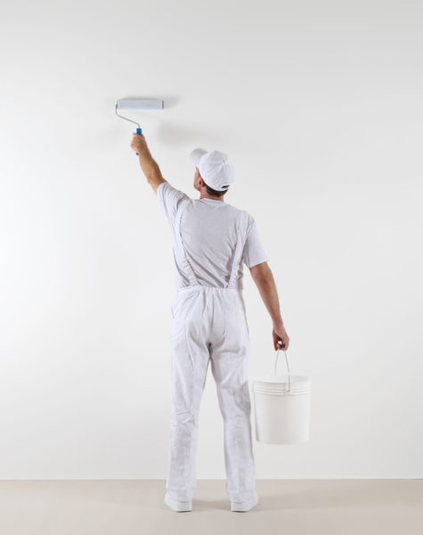 Rear,View,Of,Painter,Man,Painting,The,Wall,,With,Paint